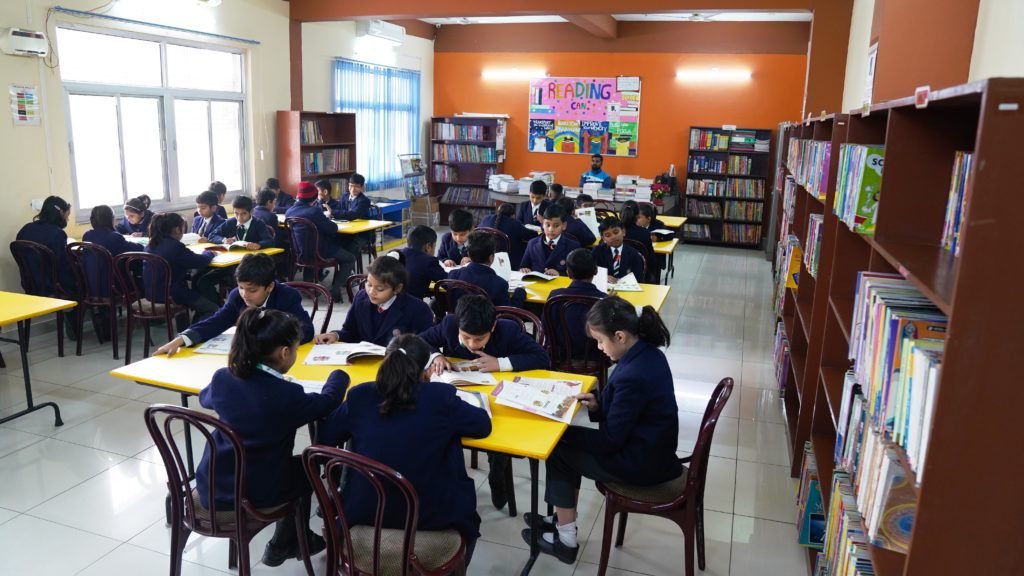 Students reading in the Excellia School library